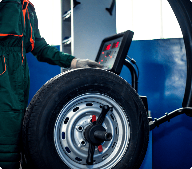 Tire being balanced in workshop