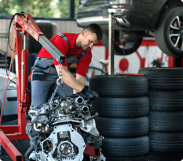 Mechanic working on car engine